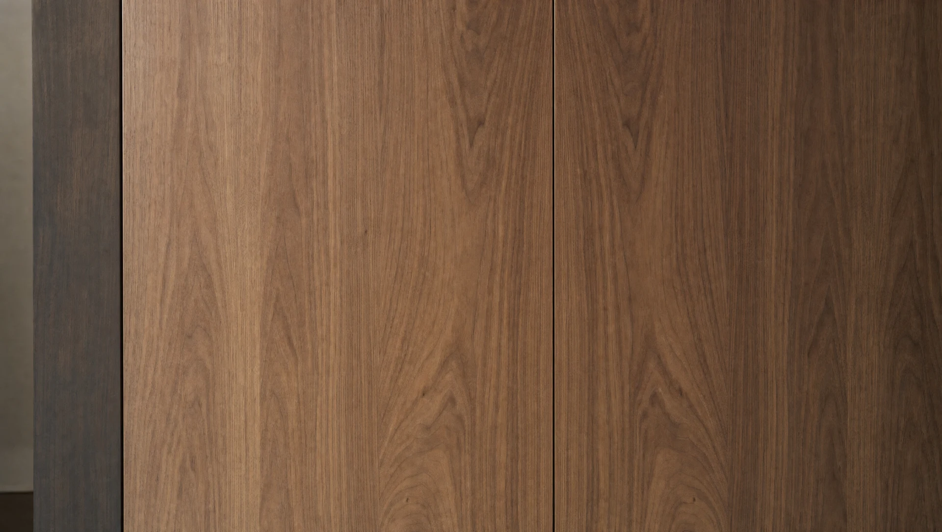 Book-matched veneer across a run of handleless doors, The Kensington