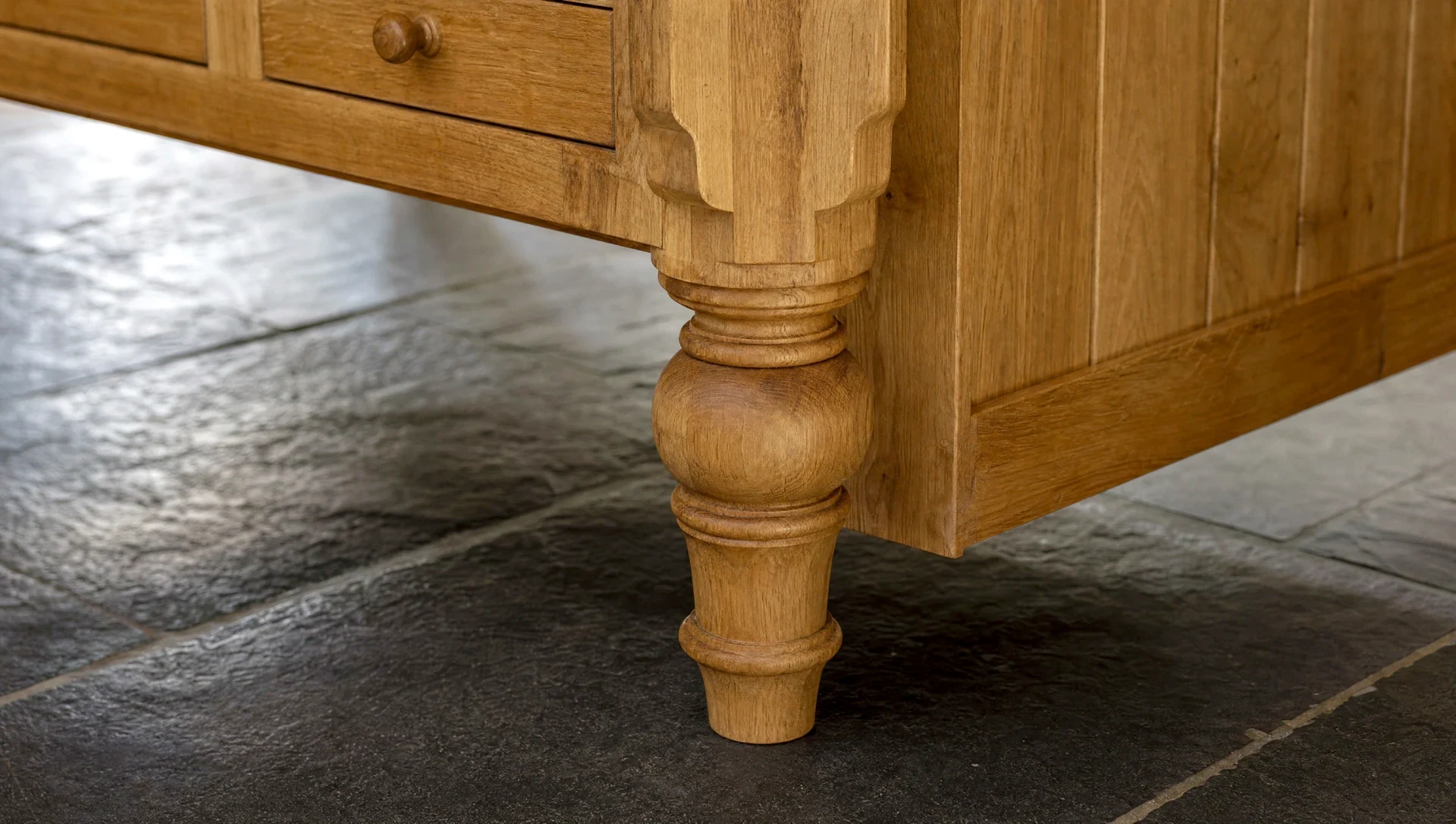 A turned oak leg and rail on a freestanding island, Modular & Freestanding by Square & True