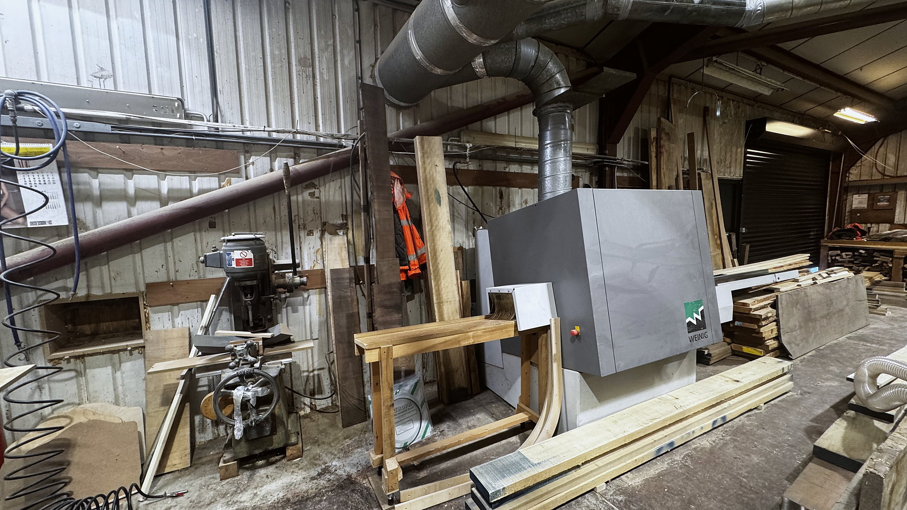 Timber and machinery in the Square & True workshop at Mickfield, Suffolk